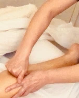 picture of a massage therapist performing technique to promote blood flow and support recovery